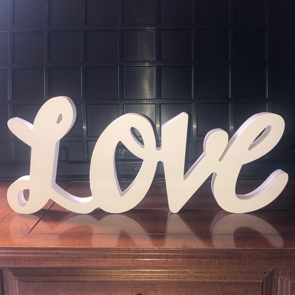 White wooden “love” sign/decor